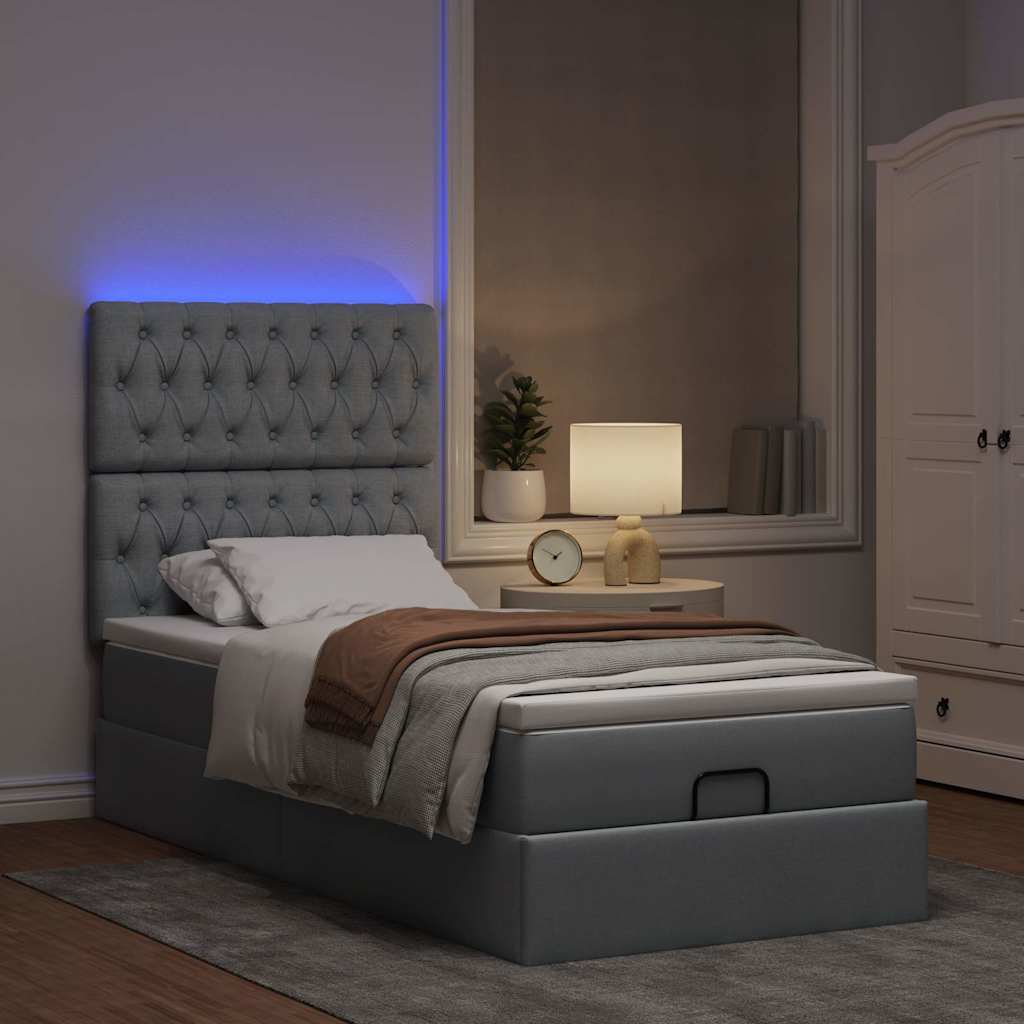 Lit ottoman avec matelas et LED gris clair 90x200 cm tissu - XIOS