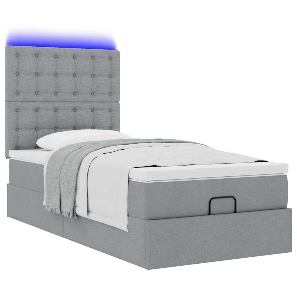 Lit ottoman avec matelas et LED gris clair 90x200 cm tissu - XIOS